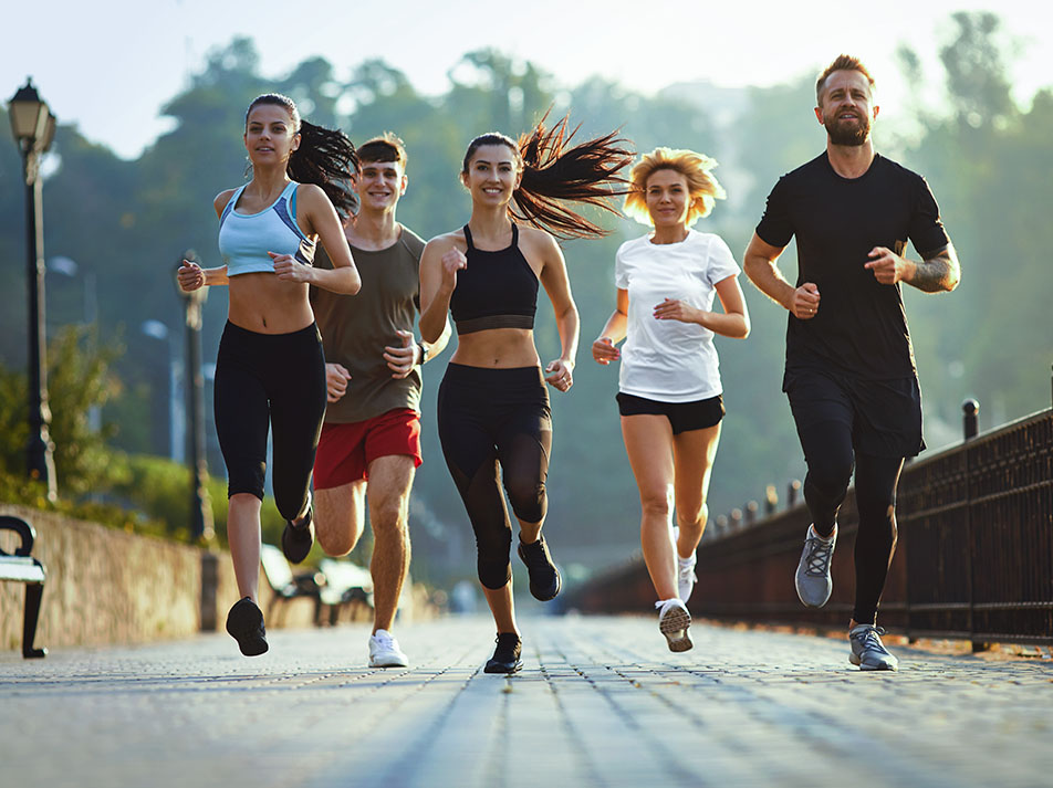 Active adults running together outdoors